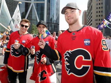 Calgary Flames players (left to right) Curtis Lazar, Johnny Gaudreau and Sam Bennett join the 2018 Pride Parade in downtown Calgary on Sept. 2, 2018.