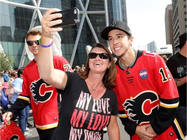 Calgary Flames players Johnny Gaudreau, right, and Curtis Lazar take part in the 2018 Pride Parade in downtown Calgary on Sept. 2, 2018.