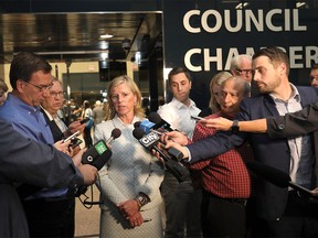 Mary Moran, CEO of Calgary 2026, speaks to media after presenting the draft host plan to city council on Tuesday, Sept. 11, 2018.