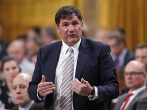 Minister of Fisheries, Oceans and the Canadian Coast Guard Dominic LeBlanc rises in the House of Commons during Question Period in Ottawa on June 11, 2018. The federal intergovernmental affairs minister says it is disappointing the Ontario government has resorted to the Constitution's notwithstanding clause to forge ahead with plans to cut the size of Toronto city council. Dominic LeBlanc warns that Ontarians will ultimately judge the provincial government's actions.