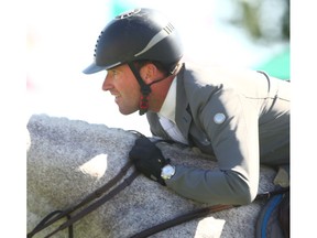 Philipp Weishaupt, from Germany, rides Solitaur in the Suncor Energy WInning Round at Spruce Meadows in Calgary on Saturday He took first place. Photo by Jim Wells/Postmedia.