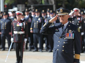 Calgary Fire Chief Steve Dongworth salutes during the ceremony to honor fallen firefighters in Calgary on Tuesday, September 11, 2018. Jim Wells/Postmedia