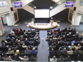 A large noon hour audience fills the lobby of the Jack Singer Concert Hall in downtown Calgary on Thursday, September 20, 2018 for a public engagement session for the Calgary 2026 Olympic bid. Jim Wells/Postmedia