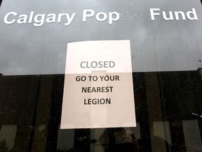 A sign is displayed on the front door of the Calgary Poppy Fund in northeast Calgary on Saturday, September 22, 2018. Jim Wells/Postmedia
