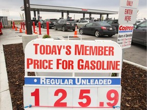 Customers fill up with gasoline at East Hills Costco in southeast Calgary on  Sunday, Sept. 23, 2018.