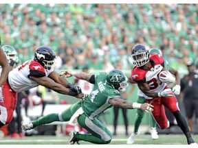 Calgary Stampeders running back Romar Morris shakes a tackle during first half CFL action against the Saskatchewan Roughriders at Mosaic Stadium in Regina on Friday, July 28, 2018.