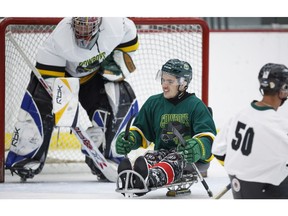 Humboldt Broncos bus crash survivor Ryan Straschnitzki, centre, plays in a fund raising sledge hockey game in Calgary, Alta., Saturday, Sept. 15, 2018.THE CANADIAN PRESS/Jeff McIntosh ORG XMIT: JMC103