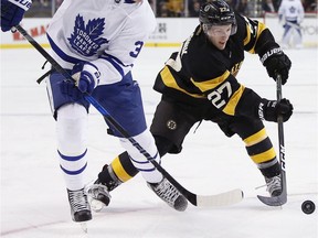 Austin Czarnik (right), then with the Boston Bruins, battles Toronto Maple Leafs' Auston Matthews for the puck during the first period of an NHL hockey game in Boston, Saturday, Dec. 10, 2016. (AP Photo/Michael Dwyer) ORG XMIT: MAMD103