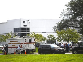 Police gather outside a Rite Aid Distribution Center, where three people died in a shooting spree on Sept. 20, 2018 in Aberdeen, Maryland. A woman opened fire at the distribution centre before fatally shooting herself.