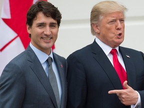 U.S. President Donald Trump, right, welcomes Canadian Prime Minister Justin Trudeau at the White House in this file photo from on Oct. 11, 2017. Canada does have some leverage as it decides whether to join a tentative U.S. deal with Mexico.
