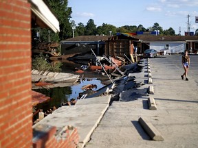 Part of the Starlite Motel is washed away in the aftermath of flooding from Hurricane Florence in Spring Lake, N.C., Wednesday, Sept. 19, 2018.