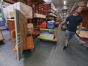 Alex Gilewicz buys supplies at The Home Depot on Monday, Sept. 10, 2018, in Wilmington, N.C.