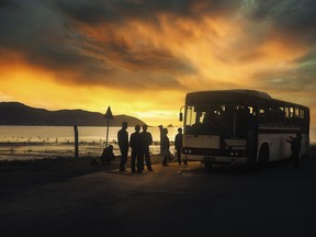 North Koreans wait for their bus. From Austin Andrews' book Red Star Utopia: Inside North Korea.