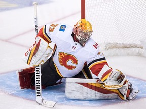 Calgary Flames David Rittich makes a glove save during the second period of a pre-season game against the Canucks in Vancouver on Wednesday, Sept. 19, 2018.