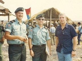 Major Norm Altenhof is on far left; other two men are unidentified.