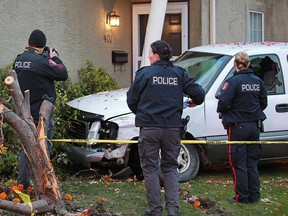Police investigate the scene a truck crash related to an overnight police chase and officer involved shooting on Tuesday September 25, 2018. The truck crashed into a home at the intersection of 32nd avenue and 2nd street N.W.
Gavin Young/Postmedia