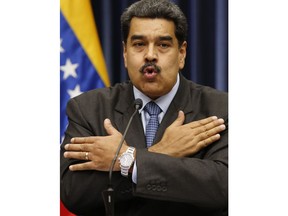 Venezuela's President Nicolas Maduro speaks during a press conference at the Miraflores Presidential Palace, in Caracas, Venezuela, Tuesday, Sept. 18, 2018. Venezuela and China have agreed to joint investments Maduro announced on Tuesday.