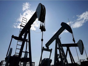 Pumpjacks at work pumping crude oil near Halkirk, Alta., on June 20, 2007.