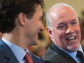 B.C. Premier John Horgan and Prime Minister Justin Trudeau at an LNG Canada news conference in Vancouver on Tuesday, Oct. 2, 2018.