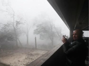 PANAMA CITY, FL - OCTOBER 10:  Derik Kline takes shelter in a parking garage as Hurricane Michael passes through the area on October 10, 2018 in Panama City, Florida. The hurricane made landfall on the Florida Panhandle as a category 4 storm.