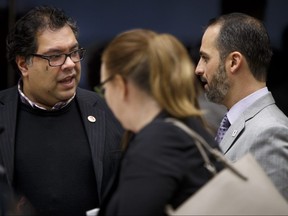 Dan Rowland (R) of the City of Denver's Office of Marijuana Policy and Department of Excise and Licenses chats with Mayor Naheed Nenshi at City Hall in Calgary, Alta., on Monday, Feb. 6, 2017. Lyle Aspinall/Postmedia Network