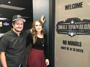 Pot shop owners Chris and Nicole Felgate in front of their store in Devon, AB.