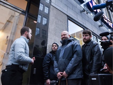 People enter a cannabis store in Montreal, Quebec on October 17, 2018. - Nearly a century of marijuana prohibition came to an end Wednesday as Canada became the first major Western nation to legalize and regulate its sale and recreational use. Scores of customers braved the cold for hours outside Tweed, a pot boutique in St John's, Newfoundland that opened briefly at midnight, to buy their first grams of legal cannabis.In total, Statistics Canada says 5.4 million Canadians will buy cannabis from legal dispensaries in 2018 -- about 15 percent of the population. Around 4.9 million already smoke.