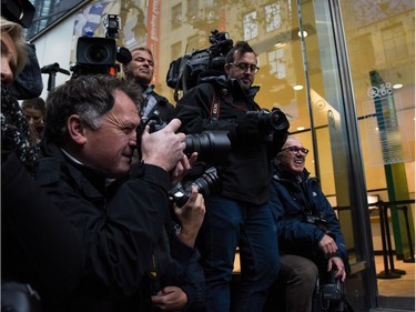 Members of the media gather as people enter a cannabis store in Montreal, Quebec on October 17, 2018. - Nearly a century of marijuana prohibition came to an end Wednesday as Canada became the first major Western nation to legalize and regulate its sale and recreational use. Scores of customers braved the cold for hours outside Tweed, a pot boutique in St John's, Newfoundland that opened briefly at midnight, to buy their first grams of legal cannabis.In total, Statistics Canada says 5.4 million Canadians will buy cannabis from legal dispensaries in 2018 -- about 15 percent of the population. Around 4.9 million already smoke.