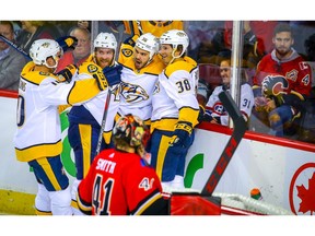 Nashville Predators Zac Rinaldo celebrates with teammates after scoring against the Calgary Flames in NHL hockey at the Scotiabank Saddledome in Calgary on Friday, October 19, 2018. Al Charest/Postmedia