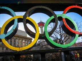 The Calgary Tower is seen through the Olympic rings at Olympic Plaza in downtown Calgary on Friday, October 26, 2018. Al Charest/Postmedia
