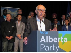 Alberta Party Leader Stephen Mandel, with nominated candidates standing behind him, speaks to members at the party's annual general meeting in Edmonton on Saturday, October 20, 2018.