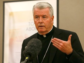 Bishop William McGrattan speaks at a news conference in Calgary on Oct. 10, 2018.