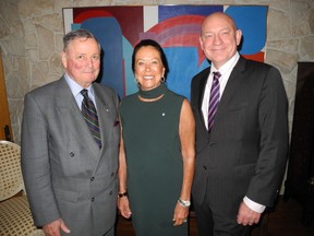Ann McCaig, centre, hosted a reception to recognize Mount Royal University's Military Memorial Bursaries program. With her are guest of honour and key-note speaker General John de Chastelain, left, and MRU president David Docherty.
Photos, Bill Brooks