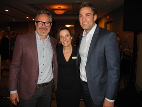 Calgary HumaneSociety executive director Carrie Fritz  (centre) is joined by Global's  Scott Fee (left) and Jordan Witzel at the Calgary Humane Society's 18th annual Cocktails for Critters. Witzel and Fee were the event emcees.