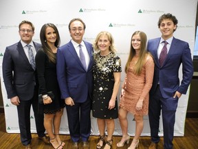 Lorenzo Donadeo (third from left) was one of four entrepreneurs inducted into the Alberta Business Hall of Fame for Southern Alberta. Joining Donadeo are, from left:  proud family members, son Franco, daughter-in-law Hayley, wife Donna, Haley Pickard and son Marco Donadeo.