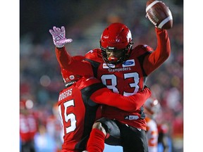 The Calgary Stampeders' Markeith Ambles celebrates with fellow receiver Eric Rogers after Ambles scored a touch down late in the first half of CFL action against the B.C Lions at McMahon Stadium in Calgary on Saturday, October 13, 2018. Gavin Young/Postmedia