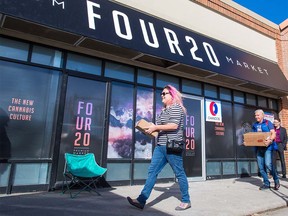 Employees carry boxes into 420 Premium Market cannabis store on Macleod Trail in Calgary on Monday October 15, 2018. The store along with nearby Nova Cannabis are the only two in the city approved for opening day on Wednesday. Gavin Young/Postmedia