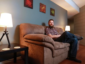 Steve Johnston sits in his Airbnb rental suite in southwest Calgary on Thursday October 18, 2018. Johnston is urging city council to be flexible when it comes to possible Airbnb regulations. Gavin Young/Postmedia