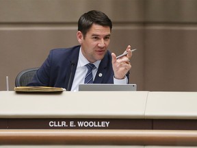 Calgary Coun. Evan Woolley asks questions of Calgary 2026 Bid Corp. representatives before a vote on a motion to end the 2026 Olympic bid process on Oct. 31, 2018.