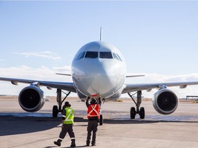 The Air Canada plane for the inaugural direct flight to Palm Springs pulls up at the Calgary International Airport. Courtesy, Neil Zeller