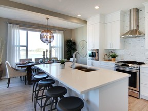 The kitchen in the Carbon ZLL show home by Cedarglen Homes in Belmont.