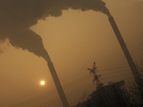 This photo taken on December 8, 2009 shows smoke belching from a coal powered power plant on the outskirts of Linfen, in China's Shanxi province, regarded as one of the cities with the worst air pollution in the world.