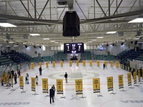 Sixteen banners in honour of the lives taken in the April bus crash are shown in the foreground and the banners for the survivors sit in the background during a tribute to the Humboldt Broncos in Humboldt , Sask., on Wednesday, Sept. 12, 2018. A Saskatchewan author says he had good intentions in writing a book about the Humboldt Broncos and the team's deadly bus crash.