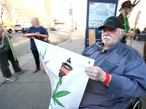 Keith Fagan (R) joins other pot supporters in front of City Hall during a rally in Calgary on Wednesday, October 17, 2018.  Jim Wells/Postmedia