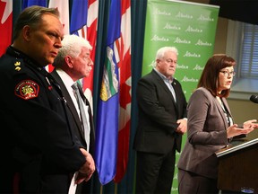(L-R) Supt. Darren Leggatt, Calgary Police Service, Brian Turpin, past president, Alberta Police Based Victim Services Association, Alf Rudd, president, Alberta Police Based Victim Services Association and Kathleen Ganley, Alberta Minister of Justice and Solicitor General speak at a press conference in Calgary on Friday, October 19, 2018. The Alberta government announce new support to ensure victims of crime Jim Wells/Postmedia