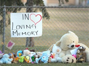 A teddy bear and stuffed animal memorial continues to grow in northeast Calgary on Saturday, October 20, 2018 near where a young was hit by a car and died on Friday morning. Jim Wells/Postmedia