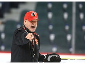 Flames head coach Bill Peters is pictured during practice in Calgary on Friday. Photo by Jim Wells/Postmedia.