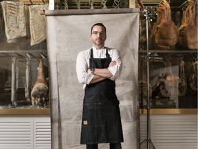 Chef Steve McHugh in front of his antique meat cooler at the entry to Cured, his upscale eatery in San Antonio's trendy pearl district. Courtesy, Josh Huskin