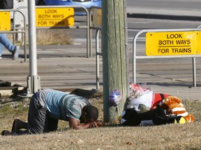 Dad of 6 year old girl who was hit and killed by the C-Train at the 162ave. Crossing reacts at the makeshift memorial residents have started on Monday October 15, 2018. Darren Makowichuk/Postmedia