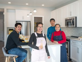 Rochelle and Ronie Deala with their children Cherobim, 26, and Elia, 23, are building a new home in Savanna with Homes by Avi.